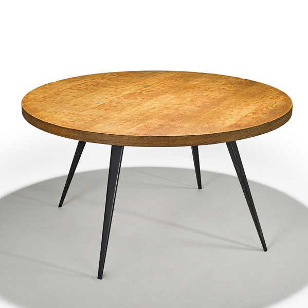 C. PERRIAND; ATELIERS JEAN PROUVE Dining table: CHARLOTTE PERRIAND ATELIERS JEAN PROUVE Dining table, France, 1950s; Oak, enameled steel; Unmarked; 26" x 48" dia.
