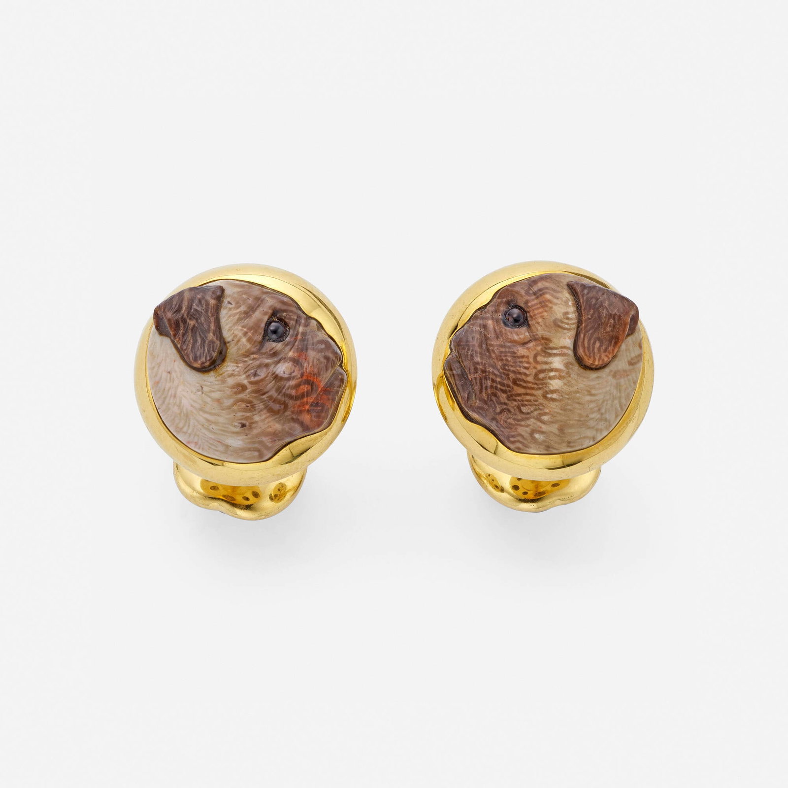 Agate and gold pug cufflinks: Agate and gold pug cufflinks Each a carved agate pug's head and tail 18k yellow gold 1.125 x 0.625 in; Gross weight 13.3 dwts This work will ship from Lambertville, New Jersey.