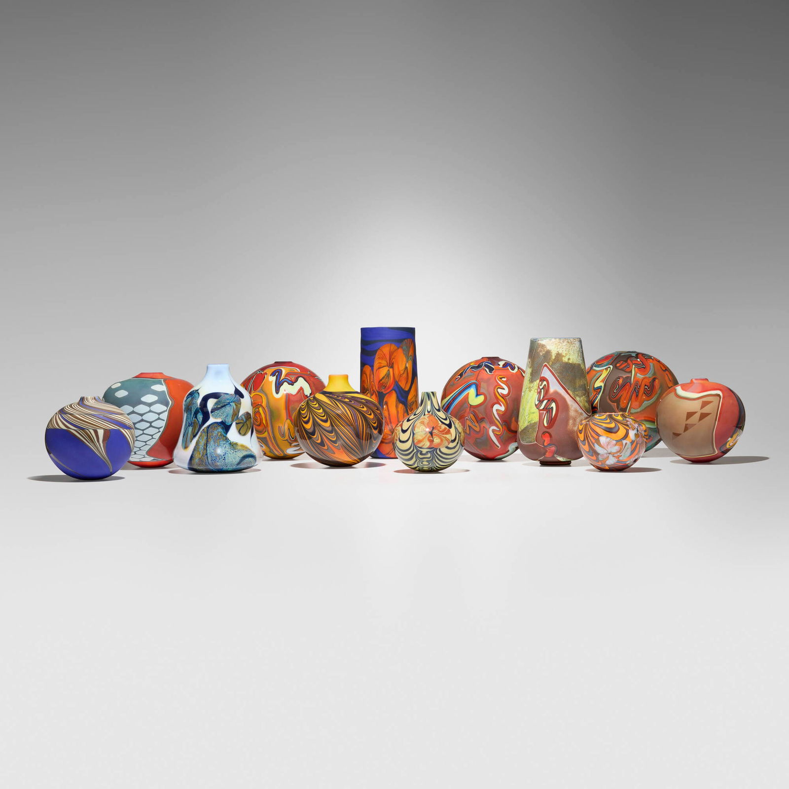 George Thiewes, Collection of twelve works: George Thiewes Collection of twelve works 1976-87hand-blown glass tallest: 9 h x 5 dia in (23 x 13 cm) shortest: 3.5 h x 4 dia in (9 x 10 cm) Etched signature to each example 'Thiewes' with