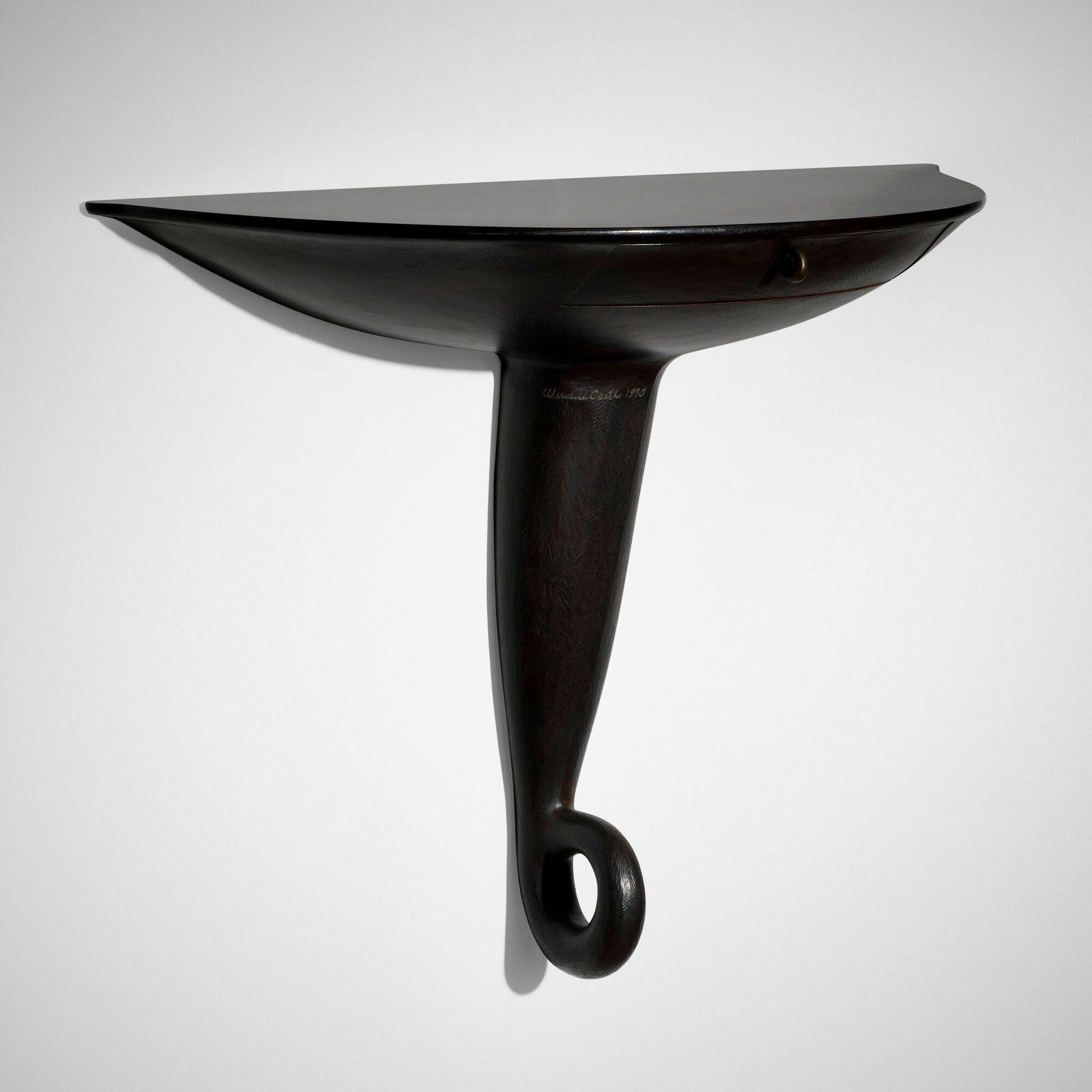 Wendell Castle, Looped demi-lune console table from Rosecliff, Inc.: Wendell Castle Looped demi-lune console table from Rosecliff, Inc. USA, 1990carved and stained jelutong, patinated bronze 34.5 h x 43.75 w x 18 d in (88 x 111 x 46 cm) Console table features o