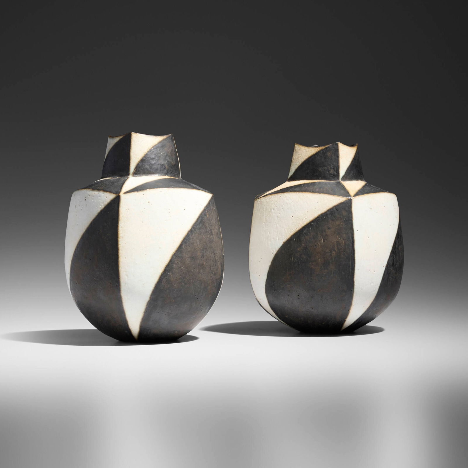 John Ward, Black and White Vessels, pair: John Ward Black and White Vessels, pair c. 1995glazed stoneware 9.5 h x 7 dia in (24 x 18 cm) 9 h x 7.25 dia in (23 x 18 cm) Impressed artist's chop mark to underside of each example 'JW'.<