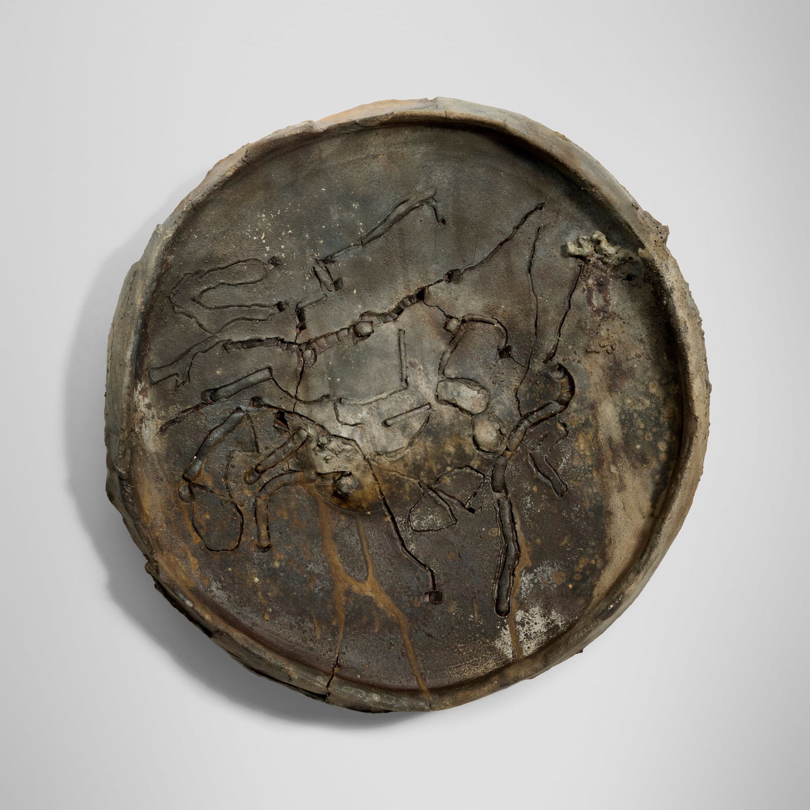 Peter Voulkos, Untitled (Plate): Peter Voulkos Untitled (Plate) 1993incised anagama-fired stoneware with pass-throughs 4.75 h x 22 dia in (12 x 56 cm) Slip signature and date to underside 'Voulkos 93'. This work is registered