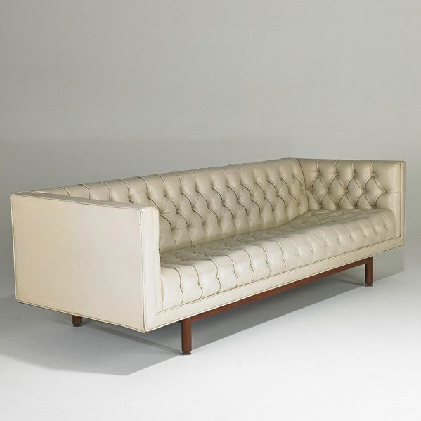 JACK CARTWRIGHT: Tufted vinyl sofa, walnut legs, USA, 1970s; Fabric label; 27" x 87" x 32"