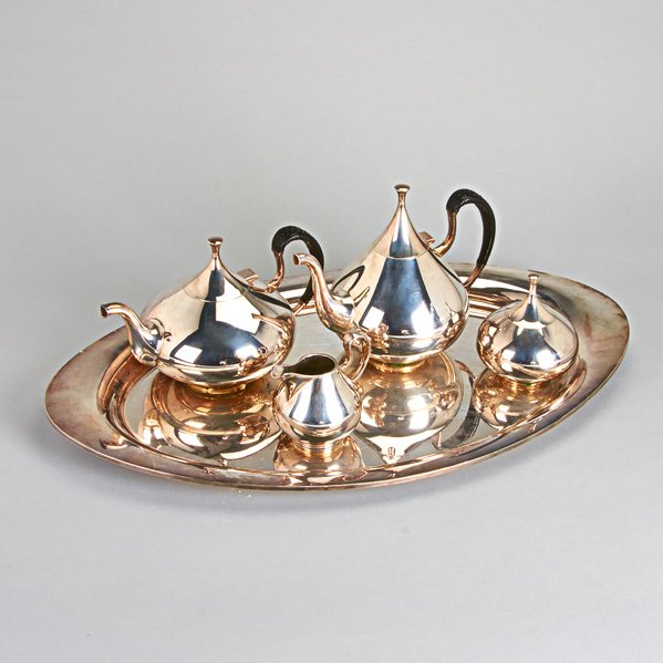 REED & BARTON "DIMENSION": Coffee service , ca. 1960, designed by John Prip, basket-wrapped black vinyl handles, silver plate; Pots: 8 1/2" and 6 1/2"; Covered sugar bowl, 5"; Cream jug, 3 3/4"; Tray, 25 3/4"