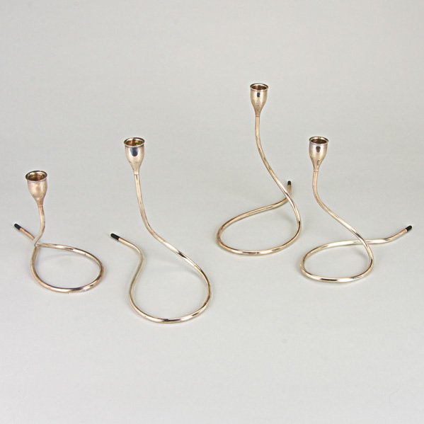 TOWLE SERPENTINE CANDLE STANDS: Four designed by Marion Anderson Noyes, ca. 1957, weighted sterling, tapered nozzles, black terminals