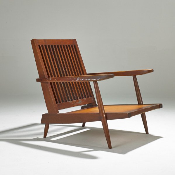 GEORGE NAKASHIMA: Walnut Cushion chair New Hope, PA; Walnut and plywood; Unmarked; 31" x 30" x 34"; Provenance: Letter of authentication from Mira Nakashima