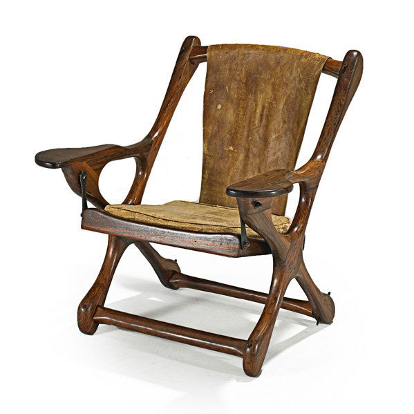 DON SHOEMAKER; SENAL: "Sling Swinger" rocking chair, Mexico, 1970s; Rosewood and leather; Unmarked; 32" x 30 1/2" x 30