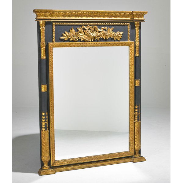 NEO CLASSICAL STYLE: Wall mirror, Italian, 20th c.; Gessoed wood, mirrored glass, gilt and ebonized decoration; Labeled Made in Italy; 52 1/2" x 40" x 3"