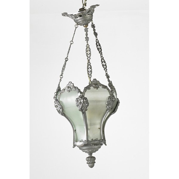 LIGHTING: Two chandeliers, 20th c. : paneled glass with ornate metal trim and polychrome leaf-decorated with globe light, electrified; Larger: 18" x 24"