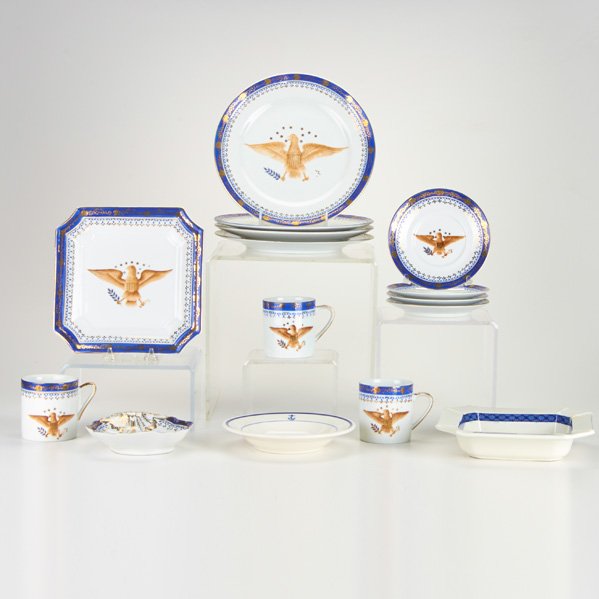 CHINESE EXPORT STYLE: Assembled set of dinnerware with eagle motif including punch bowl, twenty cups, twenty-one saucers, twelve luncheon plates, two shell-form plates, three cut-corner square dishes and eight bowls, Europ