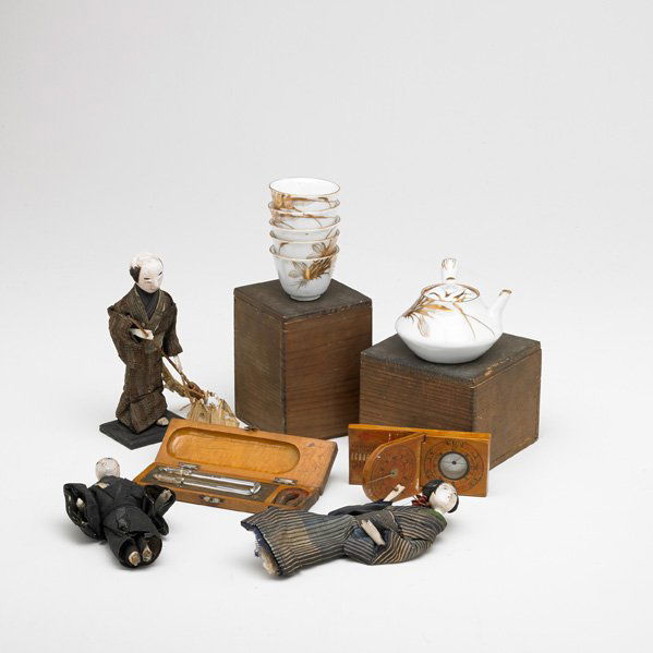 JAPANESE: Eleven pieces, 19th/early 20th c. including mercury thermometer, mapping compass, porcelain sake set, etc.; Some marked; Tallest: 6"