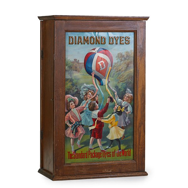 DIAMOND DYES CABINET: Litho tin door with children playing with a balloon, filled with dye packages, early 20th c.; 24 1/4" x 15" x 8"