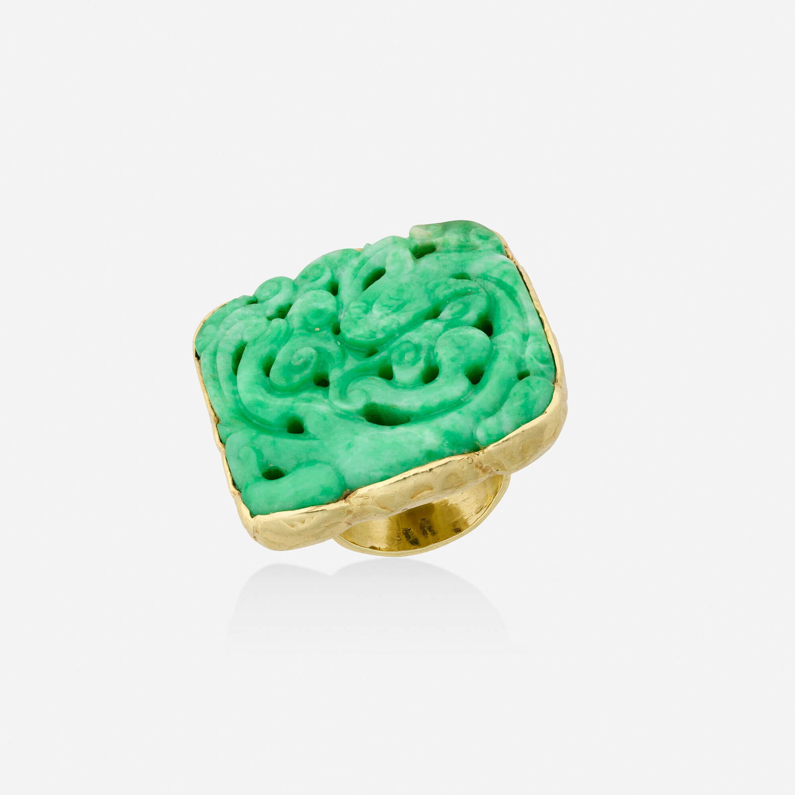 Ed Wiener, Jadeite and gold ring: Ed Wiener Jadeite and gold ring Set with carved jadeite 18k yellow gold Signed EW Ring size 7.25; Gross weight 28.4 dwts This work will ship from Lambertville, New Jersey.