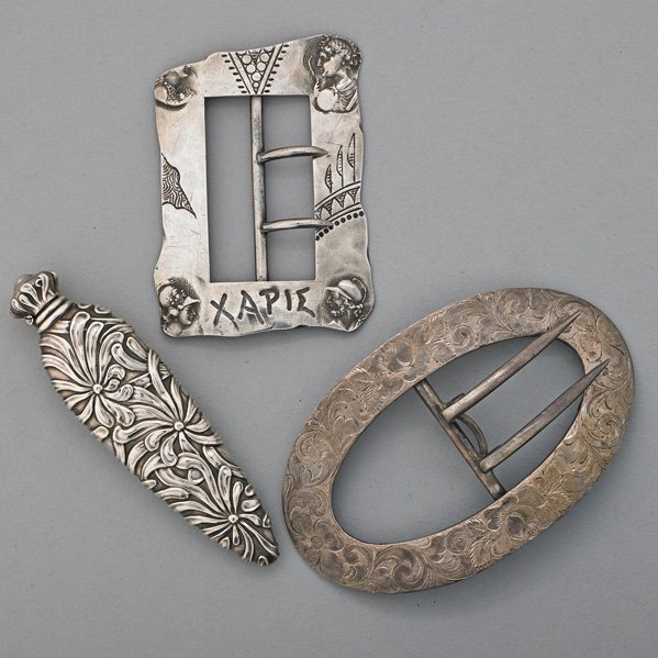 THREE AMERICAN SILVER NOVELTIES, ca. 1900: Shiebler for Tiffany & Co. Homeric sash buckle; George A. Henckel & Co. for J.E. Caldwell & Co. rococo sash buckle; Art Nouveau embossed floral scent flask; 2.6 OT, largest 3 1/2"
