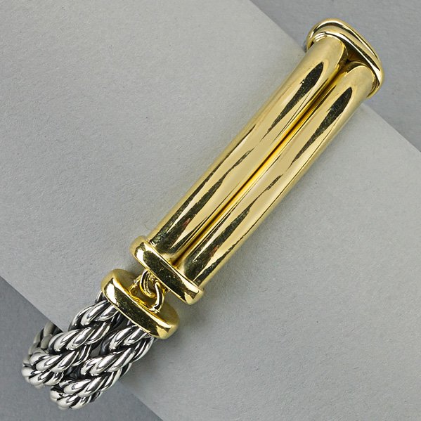 DAVID YURMAN GENTLEMAN'S I.D. BRACELET: 18k yg. and sterling, curved sections, inscribed panels; 36.4 dwt. GW (calculated 18k gold: 22 dwt.), 7 1/2"