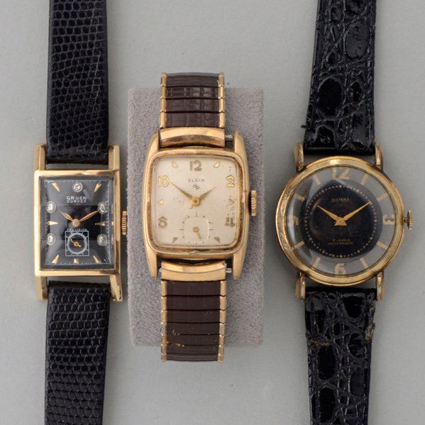 THREE VINTAGE GENTLEMAN'S WATCHES, Mid 20th C.: Gruen 14k yg. "curvex", 17 jewels, #B740261, jeweled, black dial, faceted crystal; Elgin #683 g.f. cushion-shaped, 17 jewels, #K637341; Damas rose gold-filled with skeleton hours, crystal obverse, 17