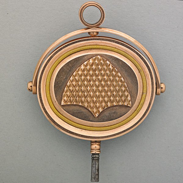 VICTORIAN WATCH FOB/KEY WITH MATCH STRIKE: Drop fob swivels, vacant carnelian obverse, approx. 10k.; Unmarked; 2 1/4" x 1 3/4"