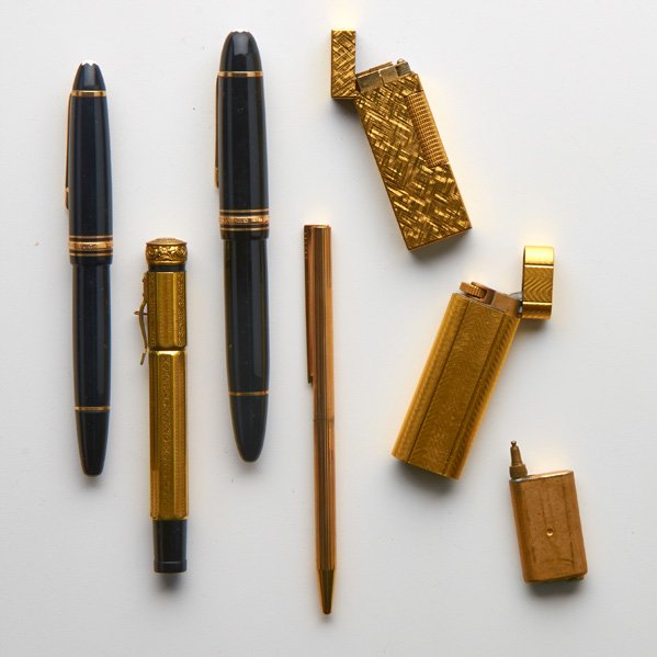 MONT BLANC, CARTIER, ETC.: Six pieces, 20th c.: Cartier lighter with wave design; Mont Blanc 146 and 149 fountain pens; Dunhill gold-filled lighter; Unmarked gold-plated fountain pen; Dupont pen; Most Marked; Longest: 5"