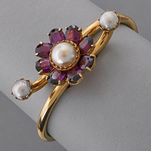 LUCIEN PICCARD 14K GOLD AMETHYST BRACELET: Victorian style 14k yg. with floral amethyst and pearl design, spring open with safety chain, ca. 1950; Marked Lucien Piccard, 14k; 15.2 dwt., interior: 2" x 1 1/2"