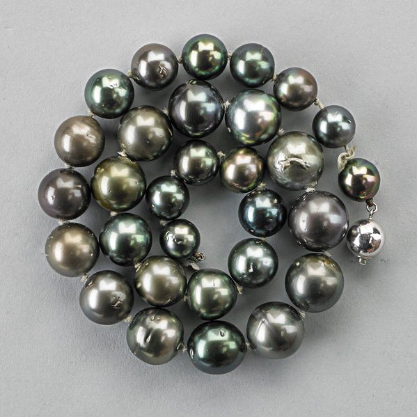 TAHITIAN BLACK PEARL NECKLACE: Thirty semispherical pearls, 14.75 - 10.5 mm., 14k wg. clasp, 17"