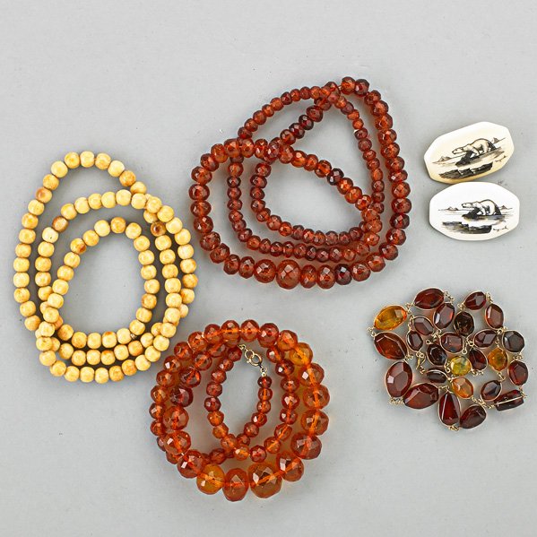 AMBER OR IVORY JEWELRY: Six pieces: Two antique strands of faceted amber beads, 20 mm. - 6 mm.; Strand whip wire amber on gold filled wire, 22"; Strand 8 mm walrus ivory beads, 28"; Two scrimshaw brooches depict polar bears 