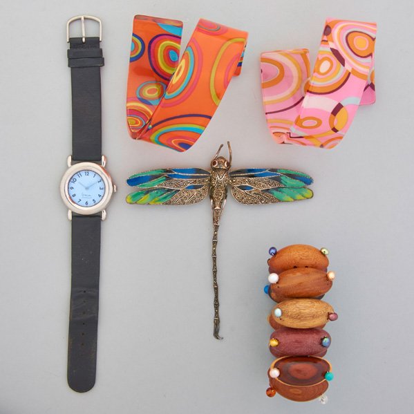 FIVE PIECES OF RECENT FASHION JEWELRY: Michael Graves for Projects steel case wristwatch with black leather band, 33 mm; Two printed plastic coiled cuffs, diameter 3"; Wood sampler stretch bracelet with gems and pearl beads; Enameled sterl
