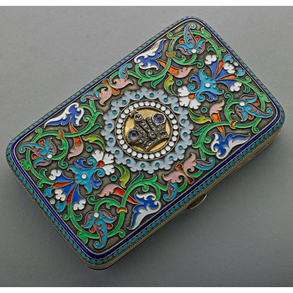 RUSSIAN JEWELED AND ENAMELED SILVER CIGARETTE CASE: Cloisonné enameled polychrome surfaces, applied silver crown on lid with rose cut diamonds and sapphires; Questionable marks for Khlebnikov, Moscow, 1899-1908, Imperial warrant; Undetermined age; 5.7