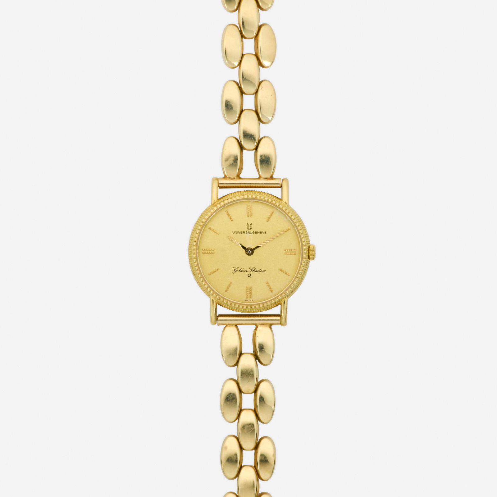 Universal Geneve, 'Golden Shadow' gold wristwatch: Universal Geneve 'Golden Shadow' gold wristwatch With baton hours, the bracelet by Milor Dial: Gold Movement: Quartz Case material: 18k yellow gold Case size: 23 mm Bra