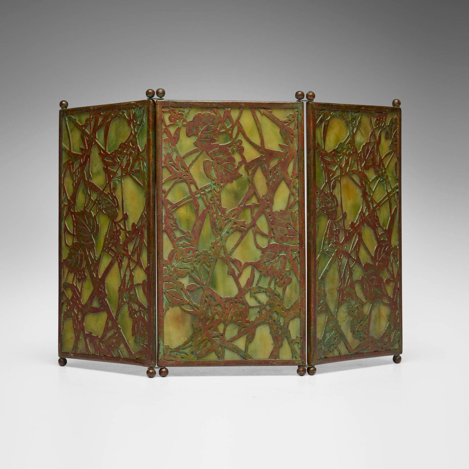Tiffany Studios, Grapevine tea screen: Tiffany Studios Grapevine tea screen USA, c. 1910Favrile glass, patinated bronze overall: 12 h x 7.5 w x 0.25 d in (30 x 19 x 1 cm) Literature: Tiffany Desk Treasures,