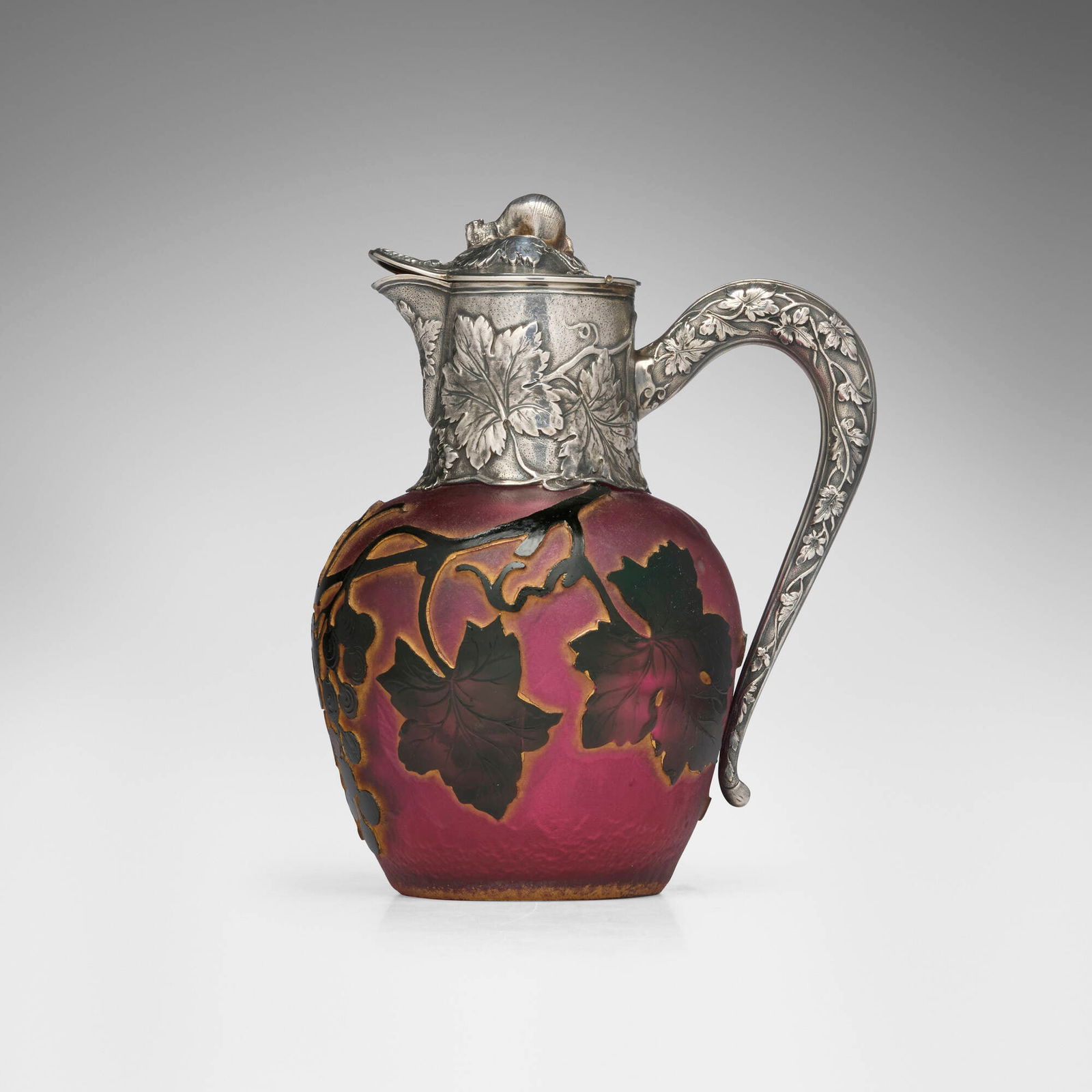 Daum, Syrup pitcher with fruiting grapevines: Daum Syrup pitcher with fruiting grapevines France, c. 1900acid-etched and gilt cameo glass, silver, parcel-gilt silver 7.125 h x 5.75 w x 4.25 d in (18 x 15 x 11 cm) Gilt signature to undersi