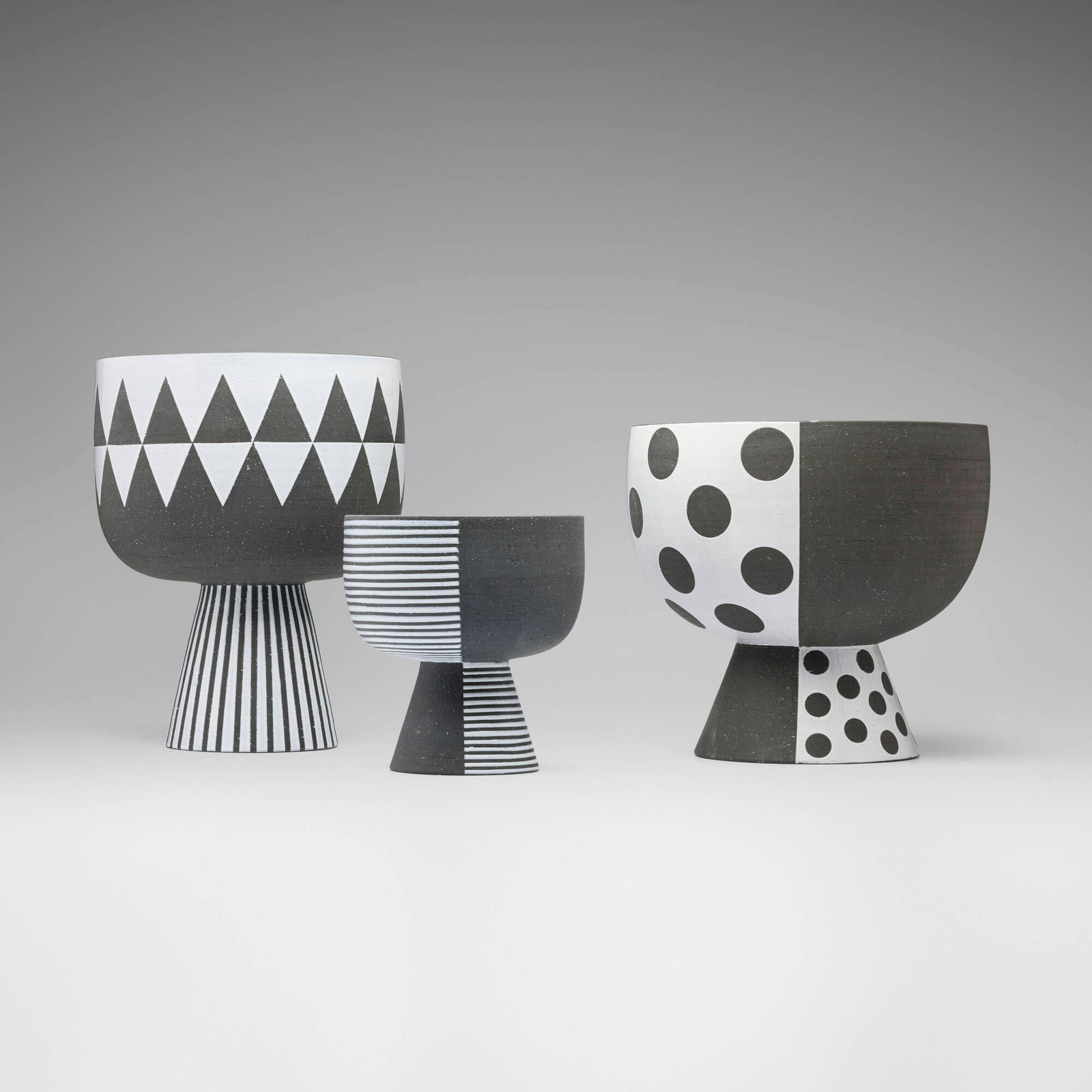 Jonathan Adler, Palm Springs Bowls, set of three: Jonathan Adler Palm Springs Bowls, set of three USAhigh-fired stoneware infused with black grog and finished with hand-applied white glaze 14.75 h x 11.75 dia in (37 x 30 cm) 12 h x 13 dia in (30