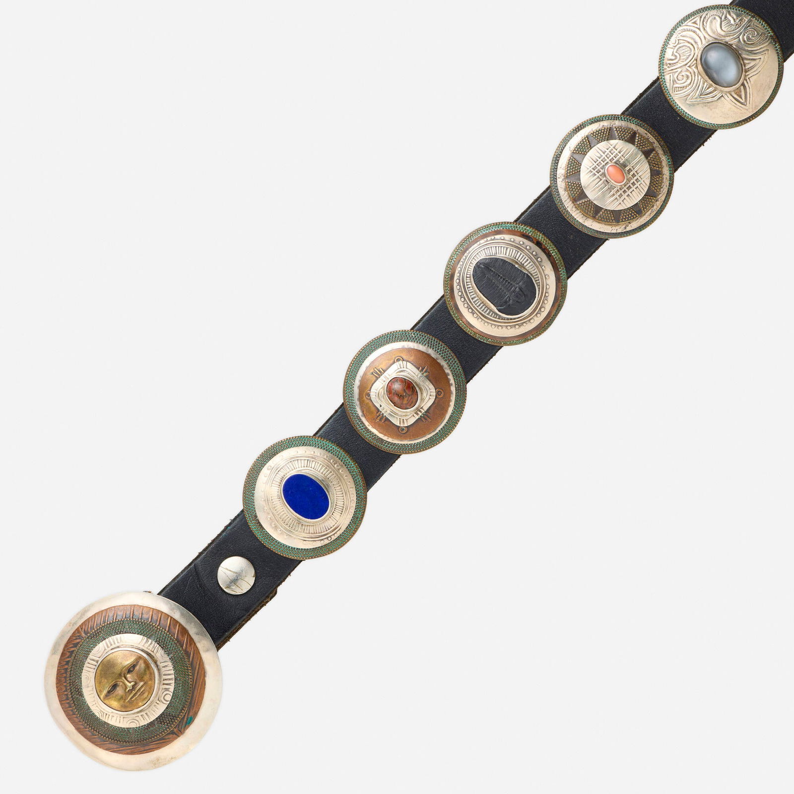 Tabra, Multi-gem concho belt: Tabra Multi-gem concho belt Designed with sixteen conchos, set with turquoise, lapis lazuli, jasper, fossil, coral, moonstone, amethyst, malachite, sugilite, tourmaline, rutilated quartz, bone, and am