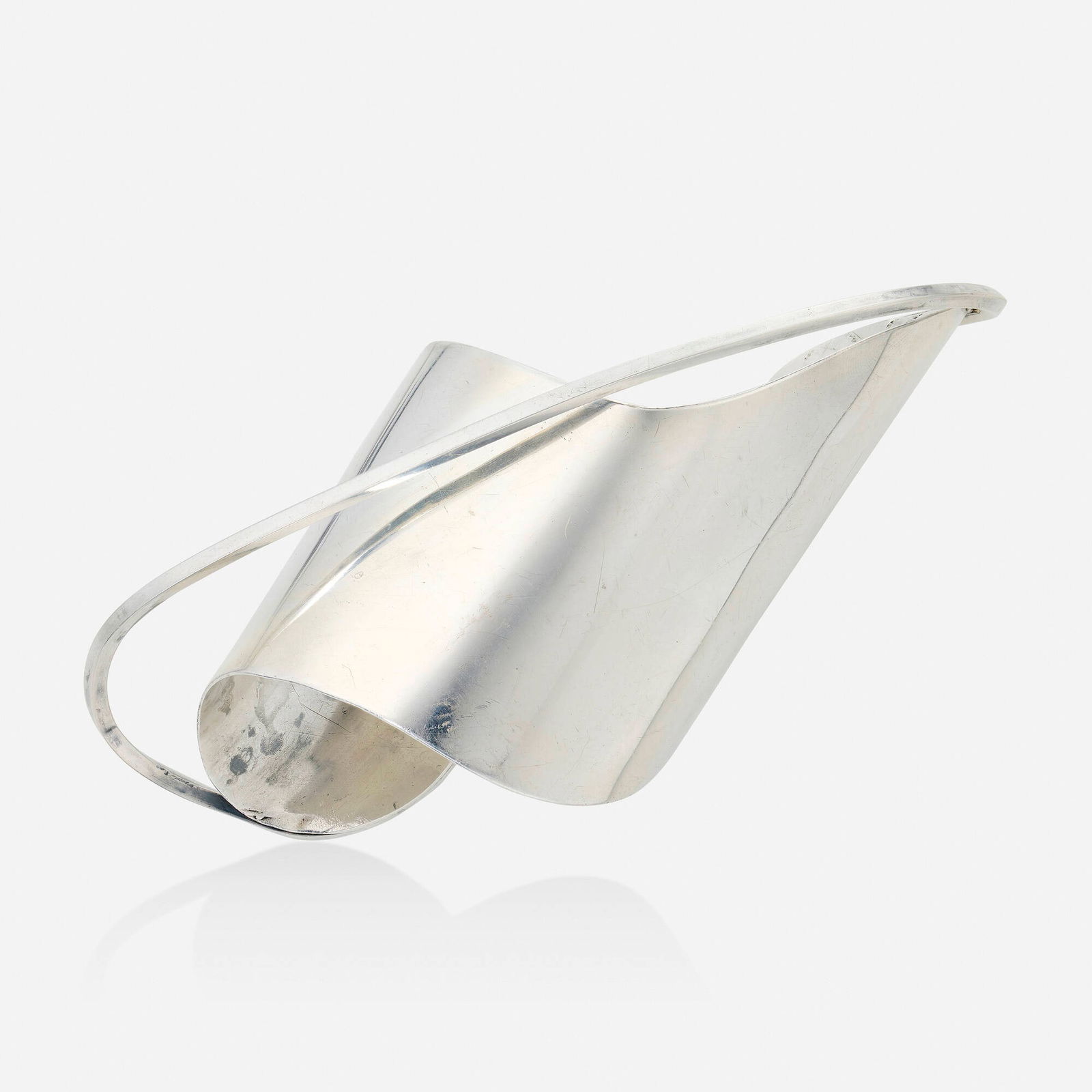 Ed Wiener, Sterling silver cuff bracelet: Ed Wiener Sterling silver cuff bracelet Of undulating design; 1950 Sterling silver Signed Ed Wiener Inner circ. approx. 6 in, length 5 in, width 3.75 in; Gross weight 53.0 dwts