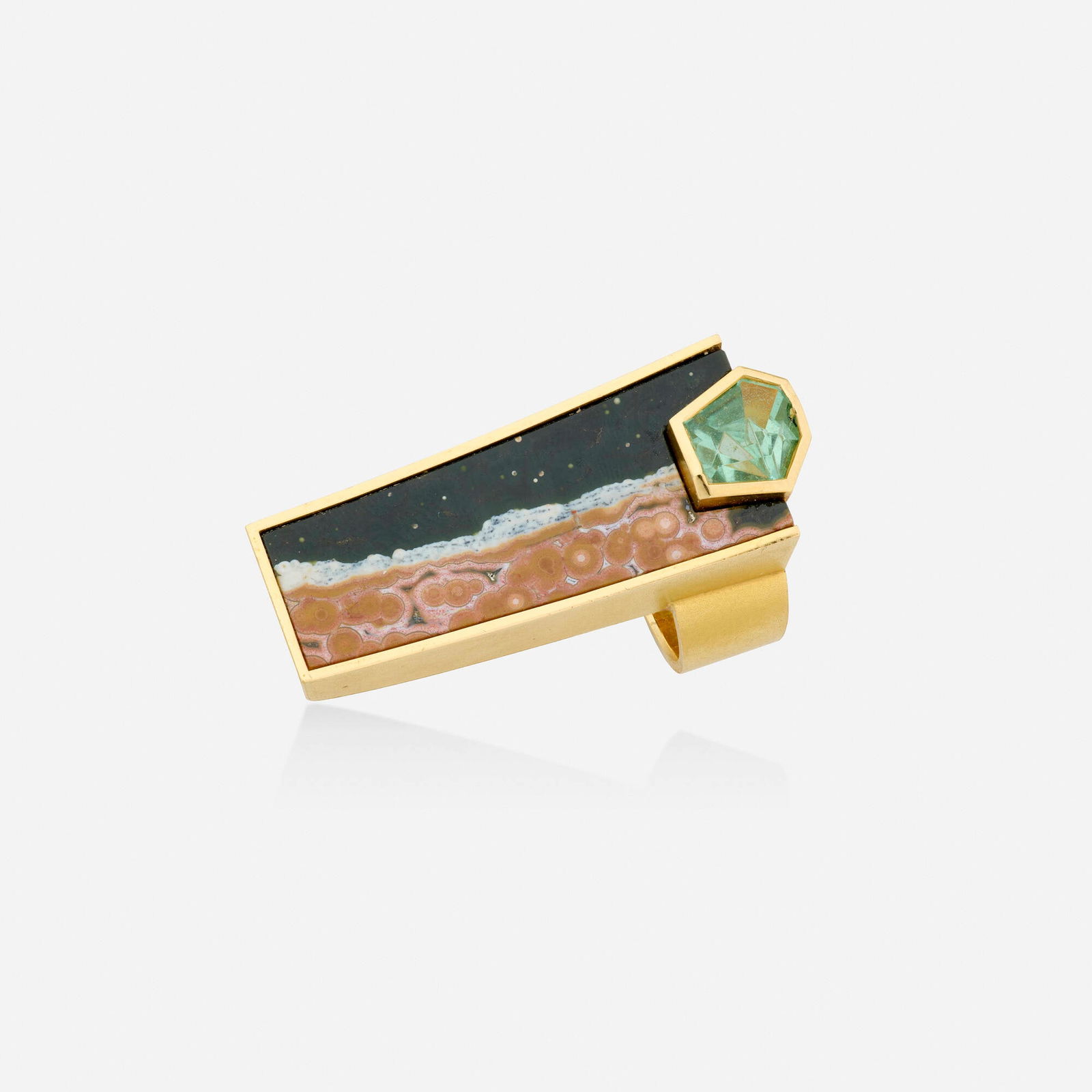 Atelier Munsteiner, Agate, green beryl, and gold ring: Atelier Munsteiner Agate, green beryl, and gold ring Set with a curved slice of agate and a fancy-cut green beryl 18k yellow gold Signed with maker's mark for Atelier Munsteiner Ring size 8; Gross w