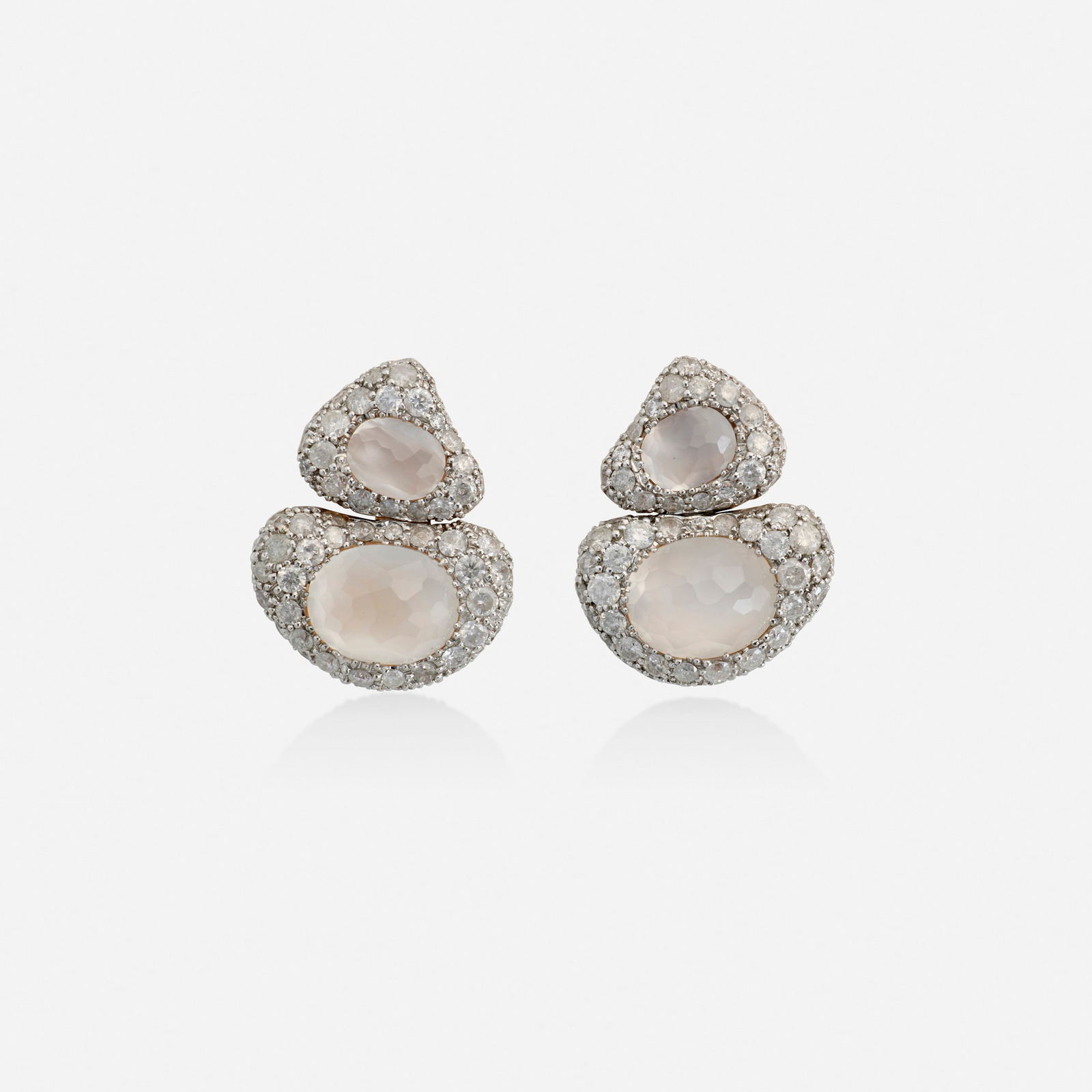 Bucherer, Moonstone, diamond, and bicolor gold earrings: Bucherer Moonstone, diamond, and bicolor gold earrings Each set with two faceted moonstones, surrounded by pave-set round brilliant-cut diamonds 18k white and pink gold Signed CB 0.75 x 0.625 in; Gr