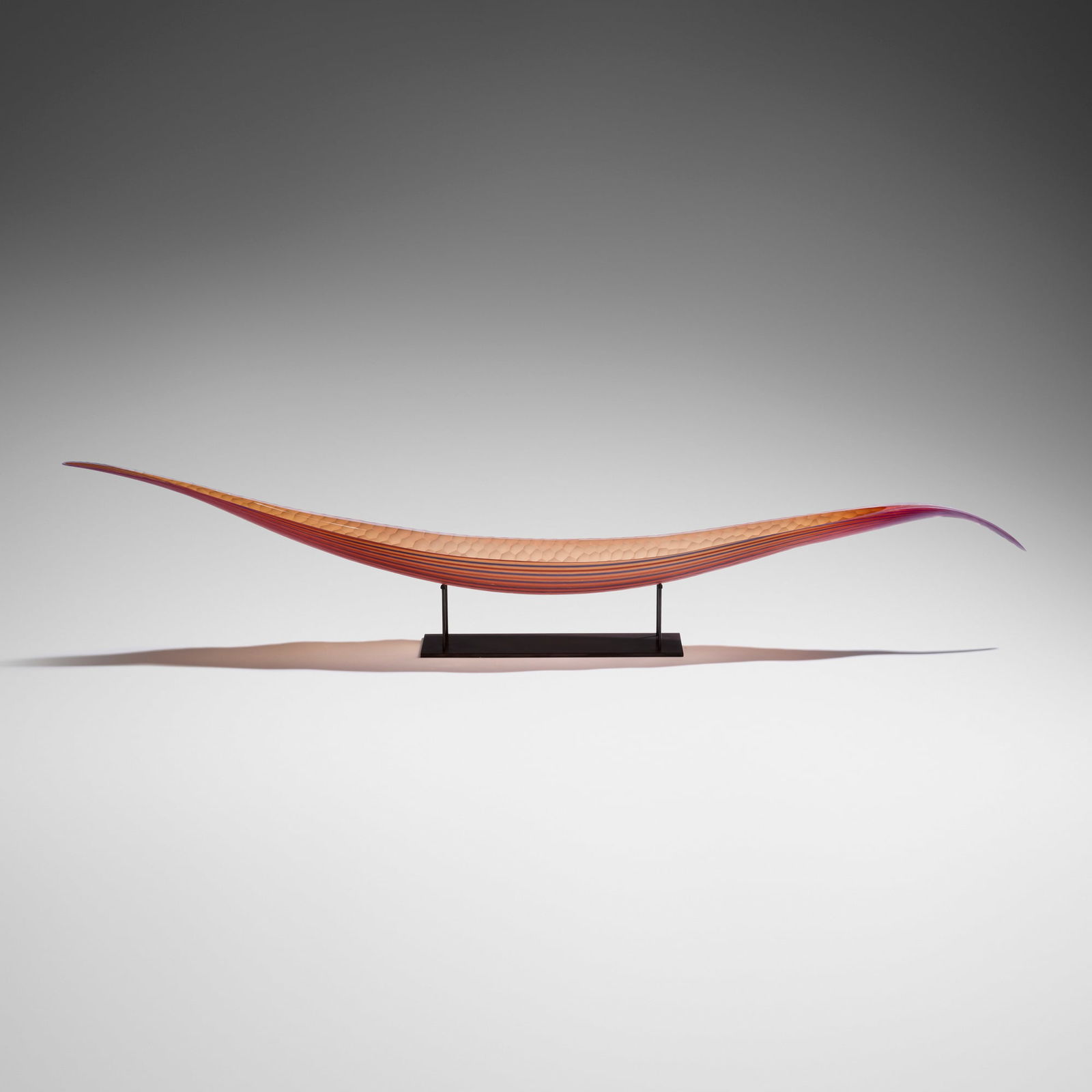 Lino Tagliapietra, Endeavor: Lino Tagliapietra Endeavor 2003hand-blown glass, battuto surface, metal stand 7 h x 57.125 w x 6 d in (18 x 145 x 15 cm) Etched signature and date to top edge 'Lino Tagliapietra 2003'.