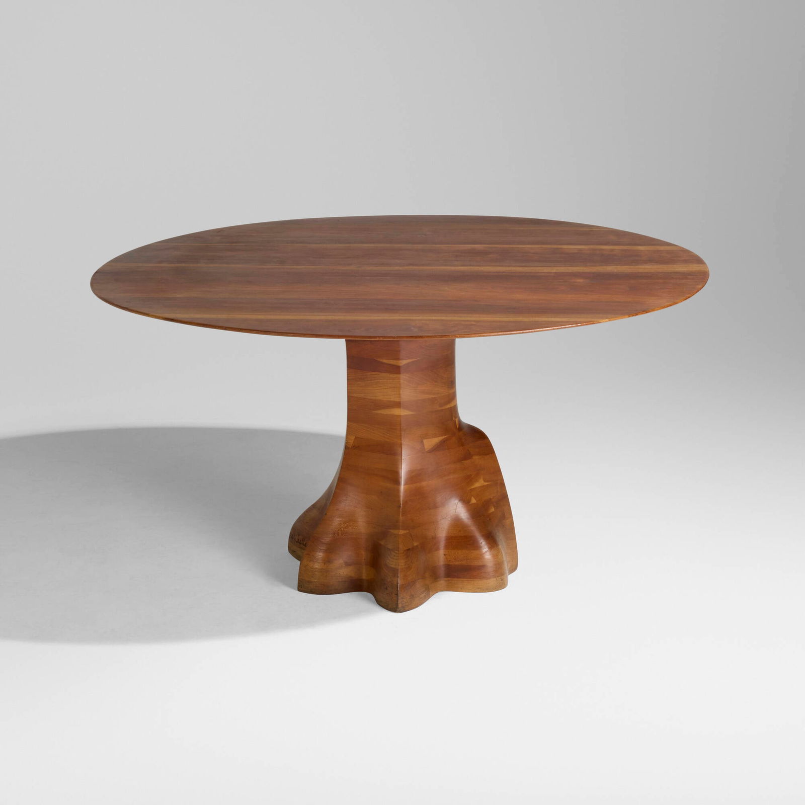 Wendell Castle, Early dining table: Wendell Castle Early dining table USA, 1978laminated and sculpted cherry 29.5 h x 53.25 w x 57 d in (75 x 135 x 145 cm) Carved signature and date to base 'W. Castle 78'. This is a unique work.