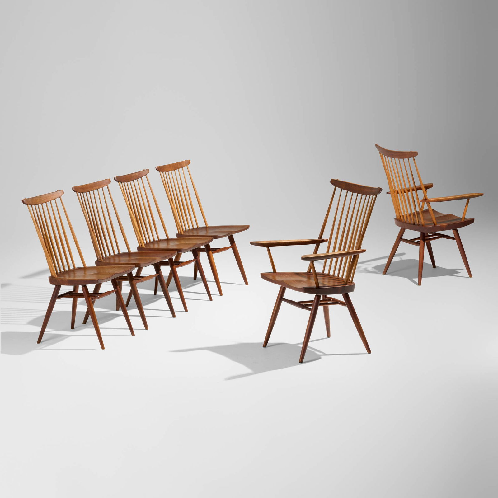George Nakashima, New chairs, set of six: George Nakashima New chairs, set of six Nakashima StudioUSA, 1975, 1980-81American black walnut, hickory 38.5 h x 24.75 w x 21 d in (98 x 63 x 53 cm) 35.625 h x 18.5 w x 20.5 d in (90 x 47 x