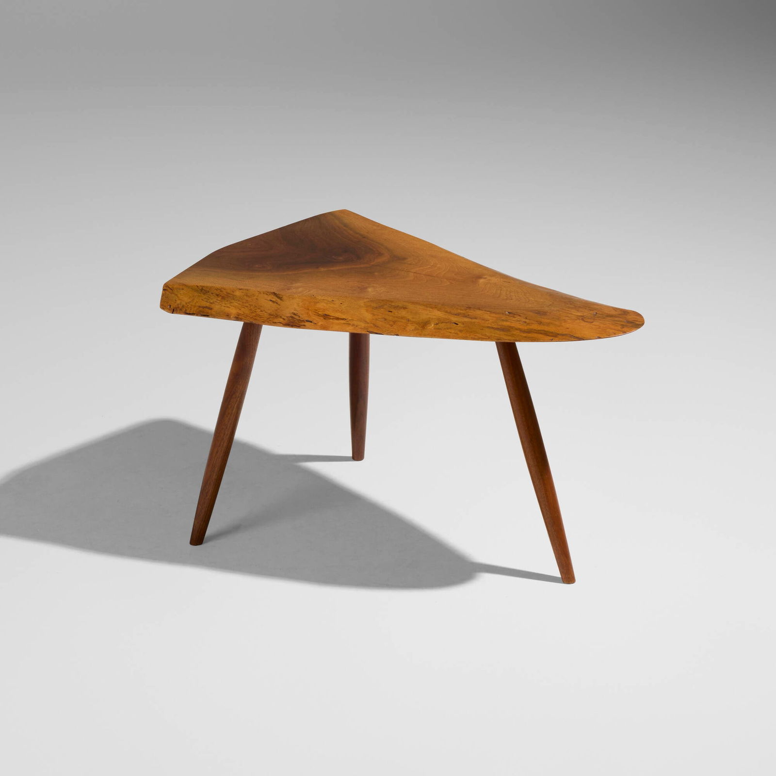 George Nakashima, Wepman occasional table: George Nakashima Wepman occasional table Nakashima StudioUSA, c. 1979English walnut, American black walnut 17 h x 19.5 w x 30.25 d in (43 x 50 x 77 cm) Heather Chalmers and Jeff Warden w