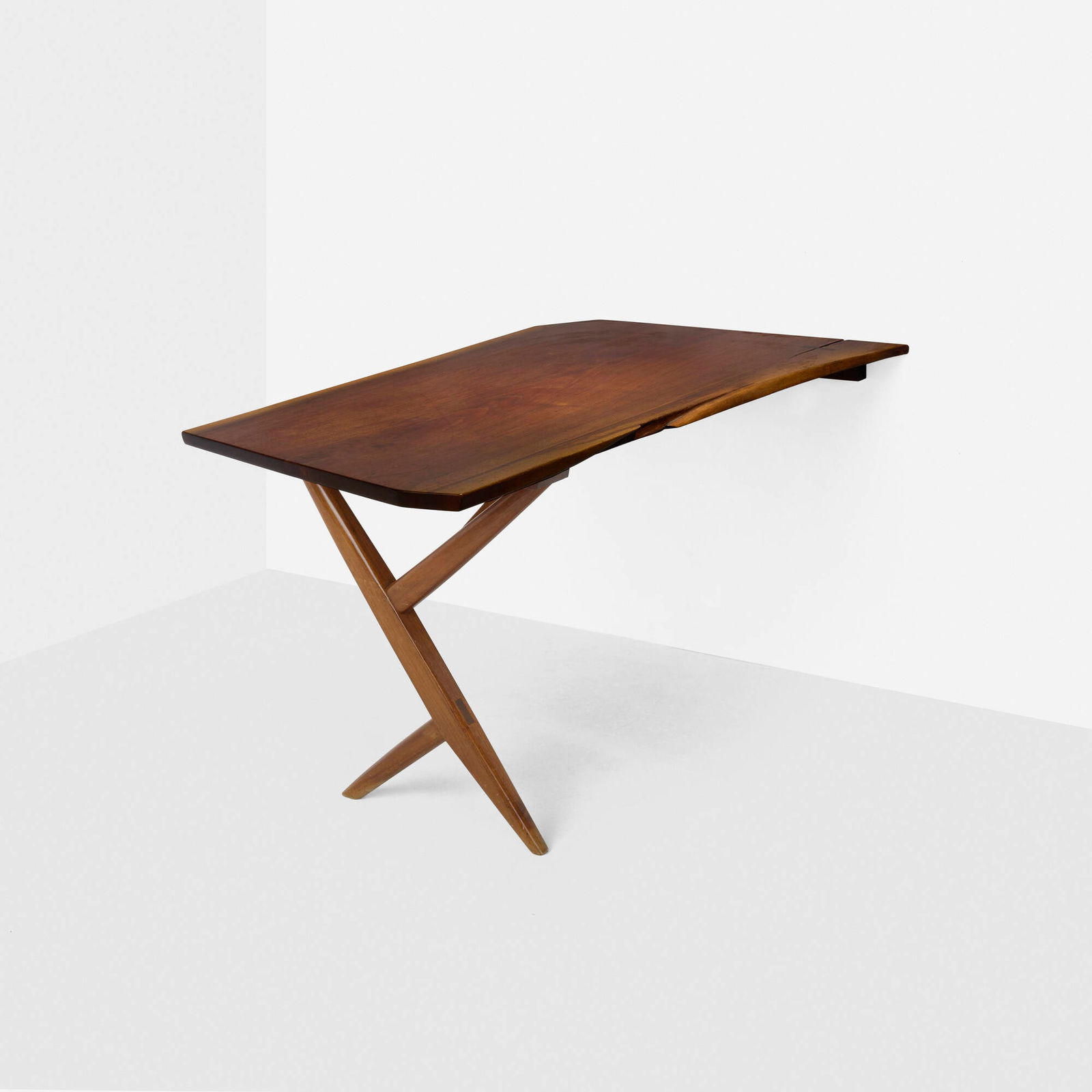 George Nakashima, Special-order Cross-Legged desk: George Nakashima Special-order Cross-Legged desk Nakashima StudioUSA, 1958American black walnut, rosewood 30 h x 34 w x 52.75 d in (76 x 86 x 134 cm) Desk features a single slab top with
