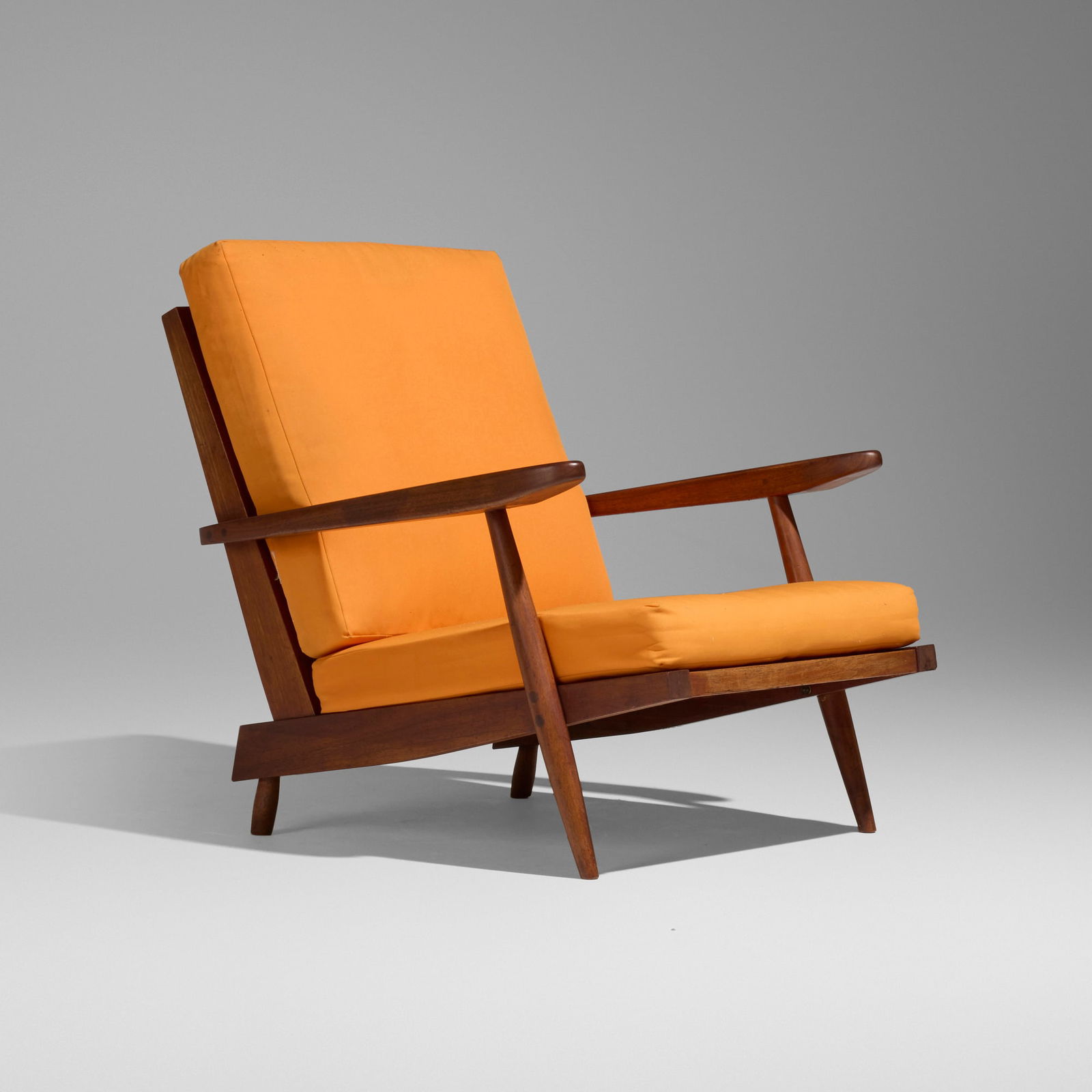 George Nakashima, Cushion Chair with Arms: George Nakashima Cushion Chair with Arms Nakashima StudioUSA, 1960American black walnut, upholstered cushions 28.75 h x 30.25 w x 35.75 d in (73 x 77 x 91 cm) Sold with a digital copy of