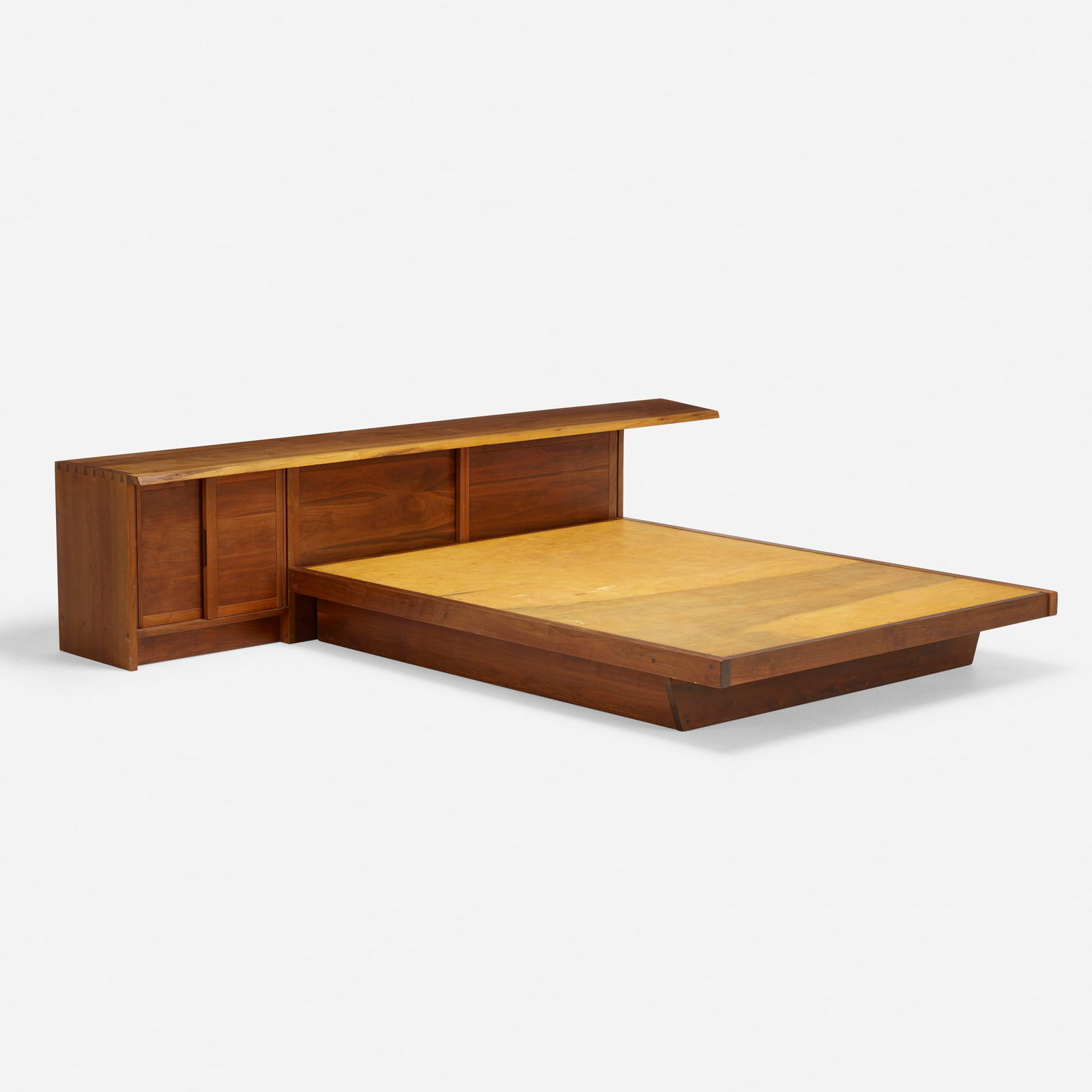 George Nakashima, Conoid headboard and Conoid full-size platform bed: George Nakashima Conoid headboard and Conoid full-size platform bed Nakashima StudioUSA, 1966American black walnut 24 h x 108 w x 91 d in (61 x 274 x 231 cm) Headboard features an overha