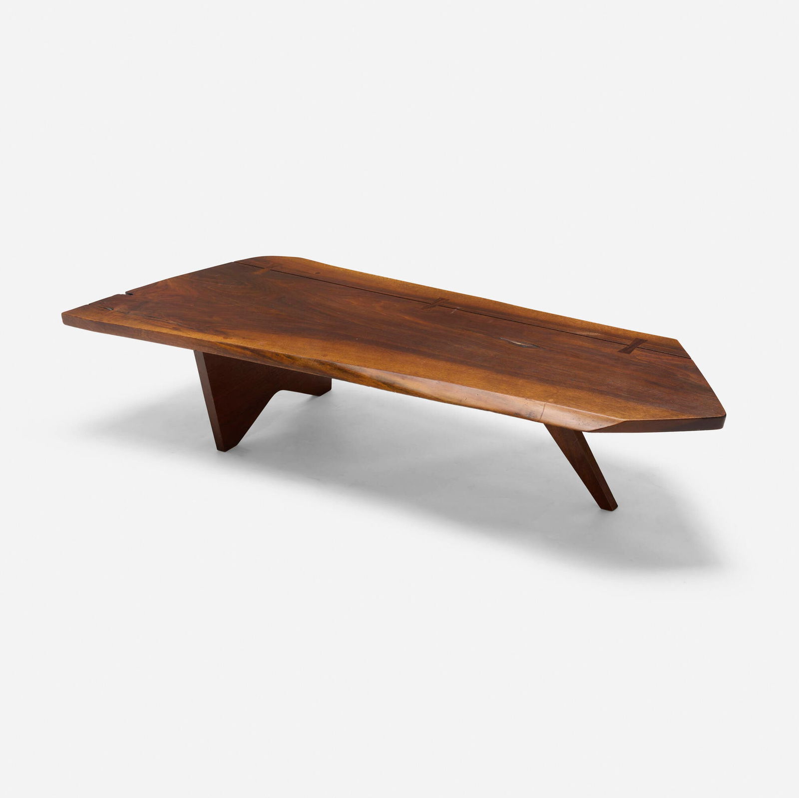 George Nakashima, Slab coffee table: George Nakashima Slab coffee table Nakashima StudioUSA, 1956American black walnut, rosewood 13 h x 63.5 w x 23.5 d in (33 x 161 x 60 cm) Table features four rosewood butterflies and two