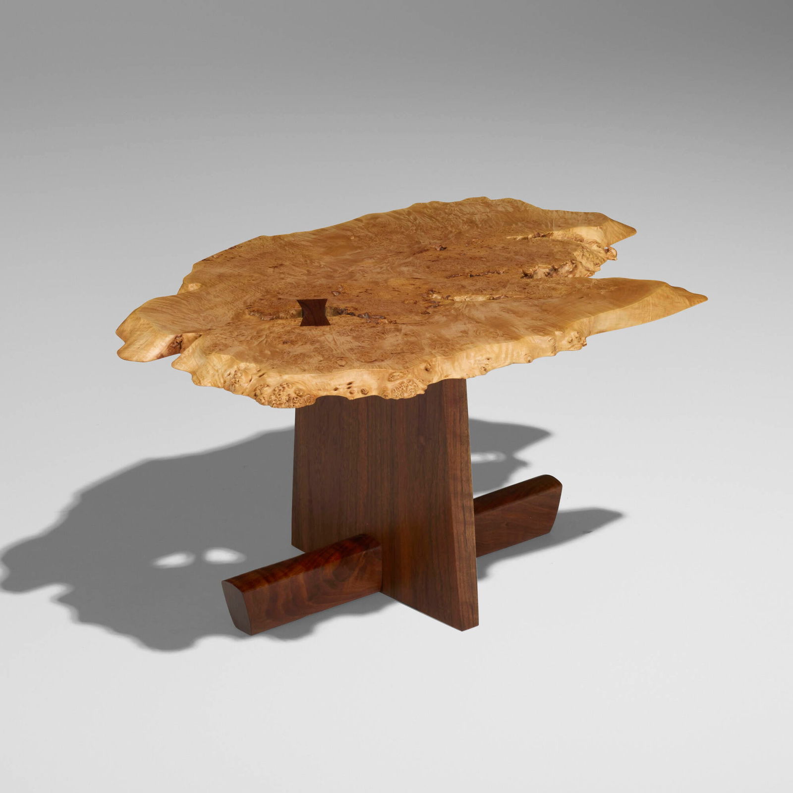 Mira Nakashima, Special-order Minguren I coffee table: Mira Nakashima Special-order Minguren I coffee table Nakashima StudioUSA, 2022maple burl, American black walnut 15 h x 29.5 w x 19.5 d in (38 x 75 x 50 cm) Table features a single slab b