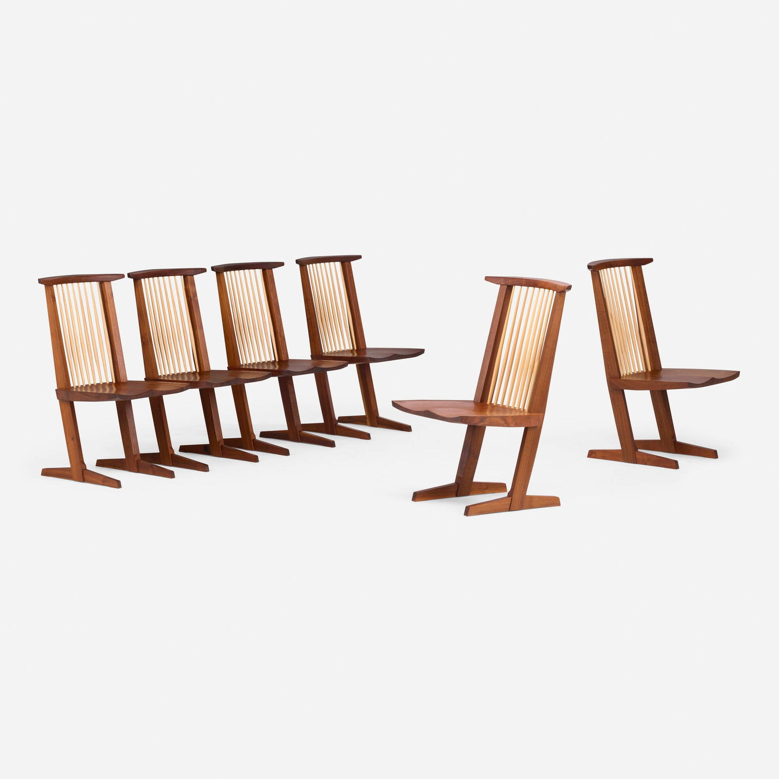 Mira Nakashima, Conoid chairs, set of six: Mira Nakashima Conoid chairs, set of six Nakashima StudioUSA, 2011American black walnut, hickory host chairs: 37.75 h x 22.75 w x 24.5 d in (96 x 58 x 62 cm) side chairs: 35.5 h x 20.75 w x