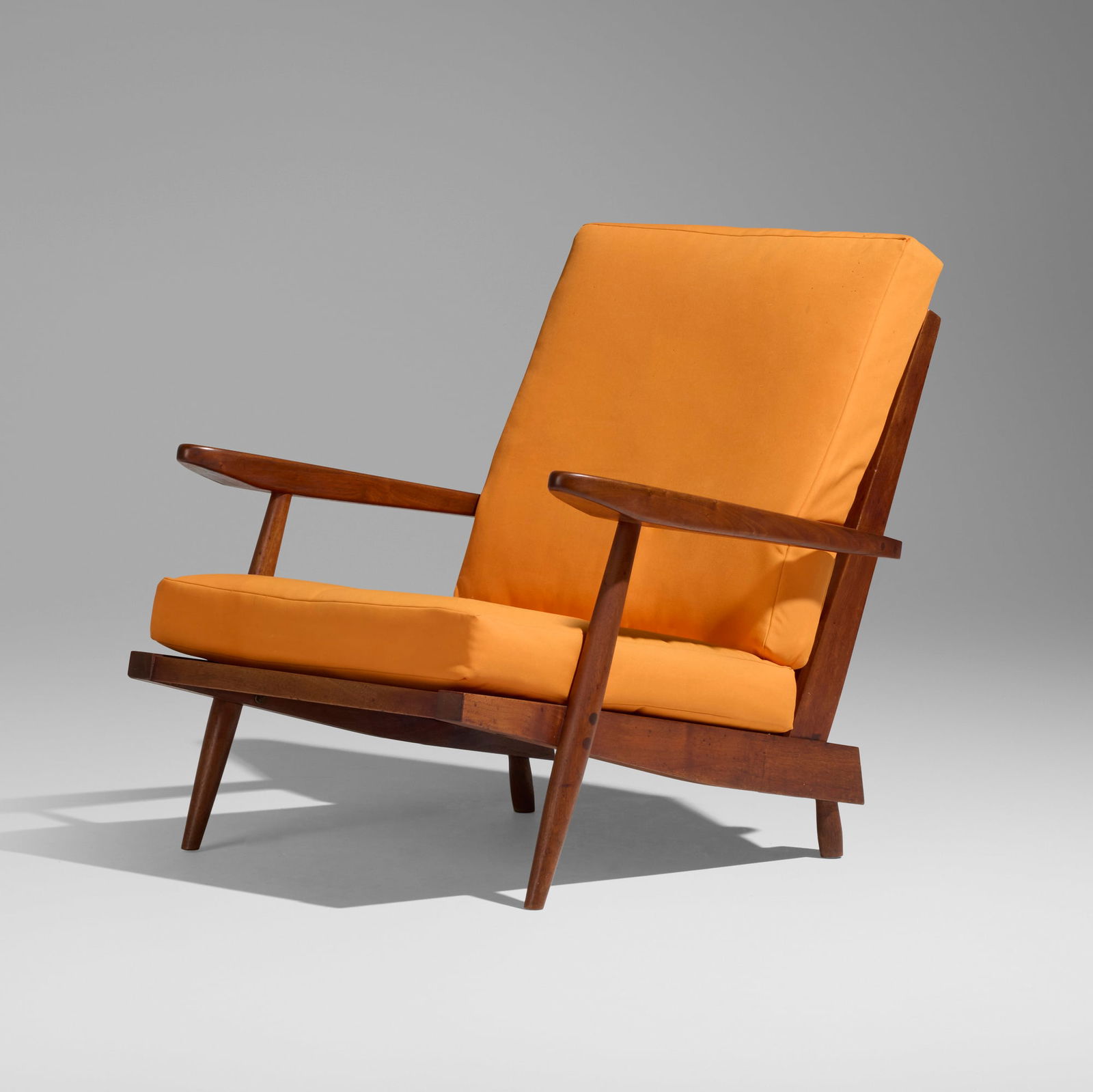 George Nakashima, Cushion Chair with Arms: George Nakashima Cushion Chair with Arms Nakashima StudioUSA, 1960American black walnut, upholstered cushions 28.75 h x 30.25 w x 35.75 d in (73 x 77 x 91 cm) Sold with a digital copy of