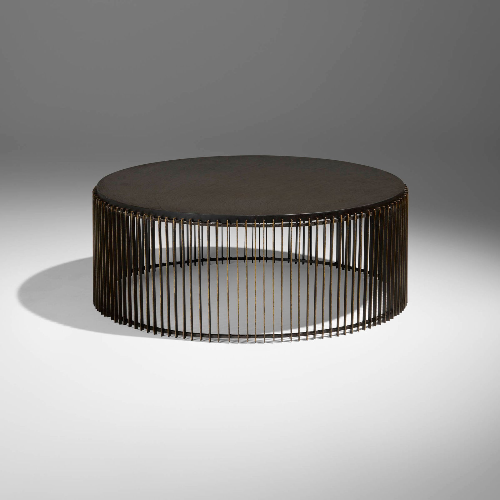 Paul Evans, Drum coffee table: Paul Evans Drum coffee table Paul Evans StudioUSA, c. 1968steel, gold leaf, slate 15.75 h x 41.25 dia in (40 x 105 cm) Provenance: Acquired directly from the artist, Col