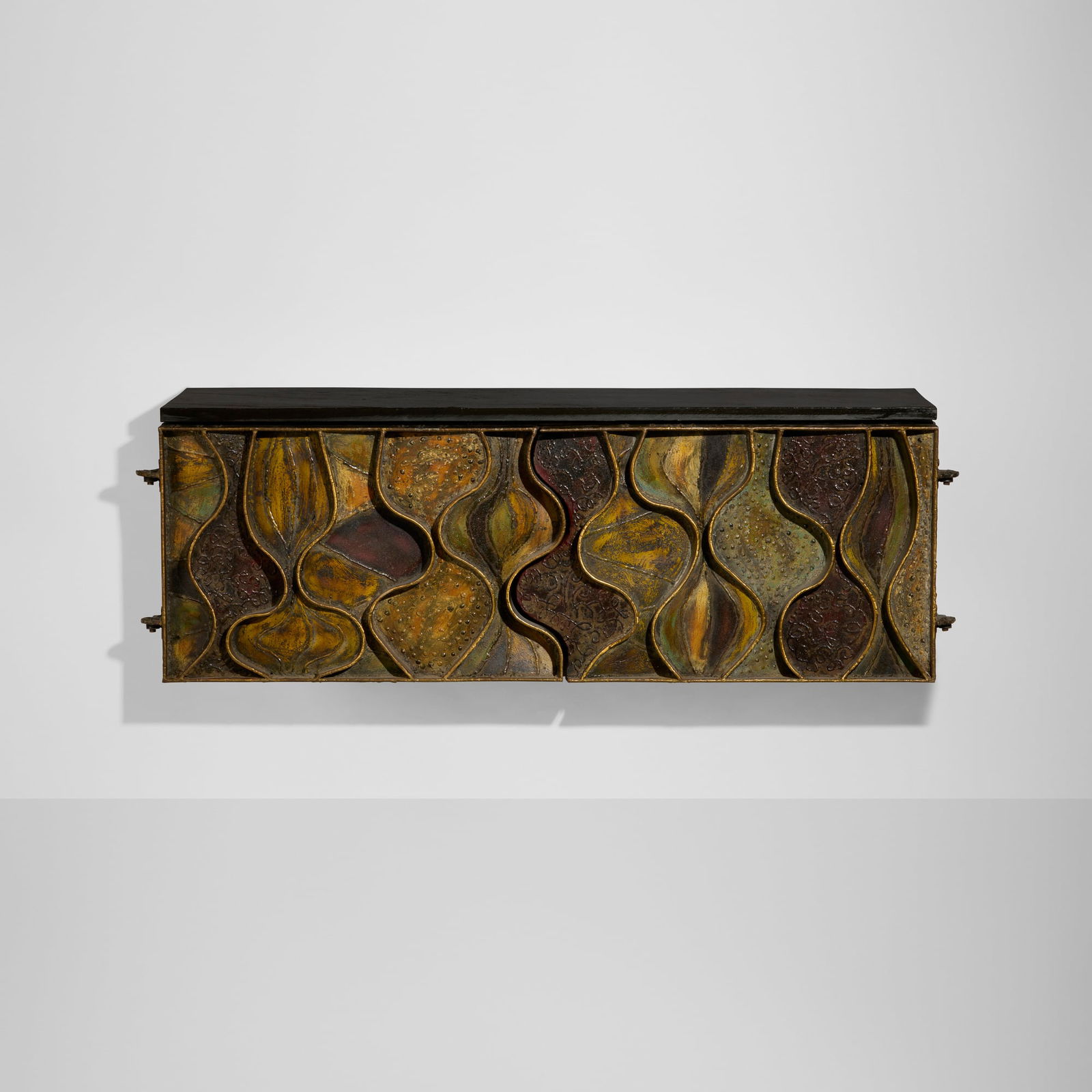 Paul Evans, Wavy Front cabinet: Paul Evans Wavy Front cabinet Paul Evans StudioUSA, 1970welded, gilt and polychromed steel, lacquered wood, felt over wood, slate 27.5 h x 62 w x 18 d in (70 x 157 x 46 cm) Cabinet featu