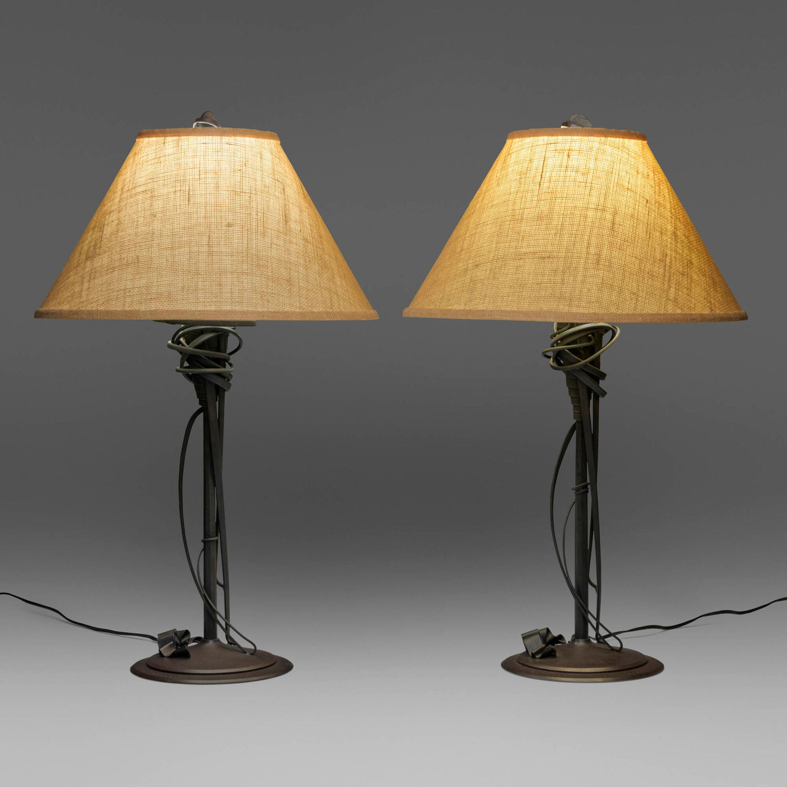Albert Paley, Table lamps, pair: Albert Paley Table lamps, pair USA, 1993forged and fabricated steel with a blackened finish, linen shades each: 30 h x 18.25 dia in (76 x 46 cm) Impressed signature and date to top of each bas