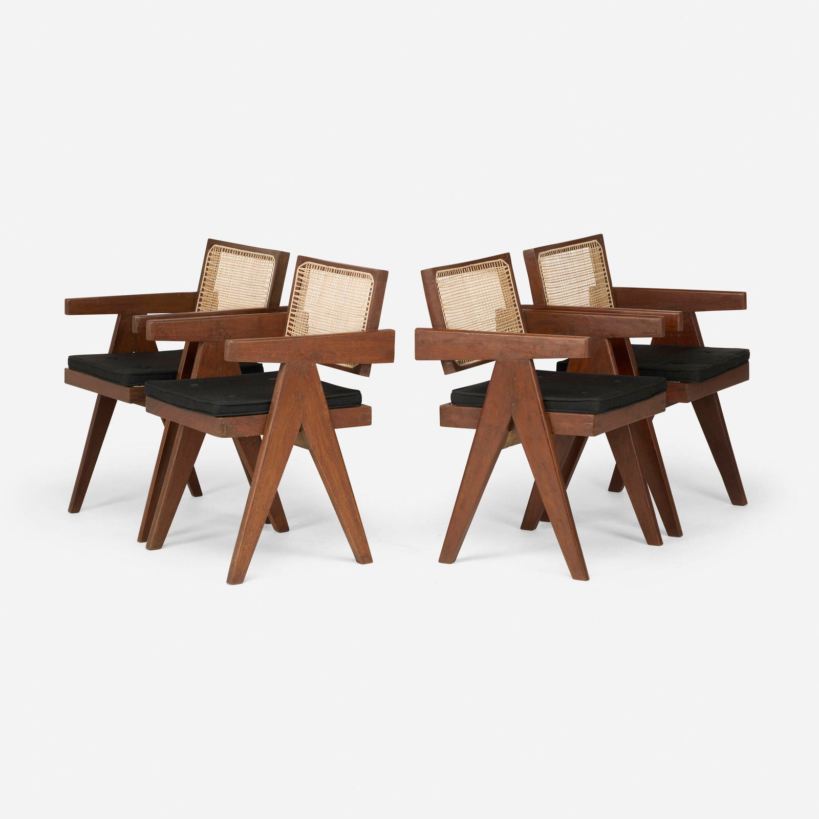 Pierre Jeanneret, Office chairs from Chandigarh, set of four: Pierre Jeanneret Office chairs from Chandigarh, set of four France/India, c. 1960teak, cane, upholstery 31.5 h x 20 w x 22.5 d in (80 x 51 x 57 cm) Stenciled marks to back of each example.